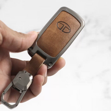 Load image into Gallery viewer, Metal Alloy Leather Key case for Tata Harrier | Punch | Tigor | Bolt | Nexon | Hexa | Zest | Tiago (3 Button Flip Key) (TAN)