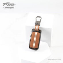 Load image into Gallery viewer, Carloginn Luxury Zinc Alloy Metal Soft Silicon Key Case for Tata Harrier | Punch | Tigor | Bolt | Nexon | Hexa | Zest | Tiago (3 Button Flip Key)- TAN COLOR